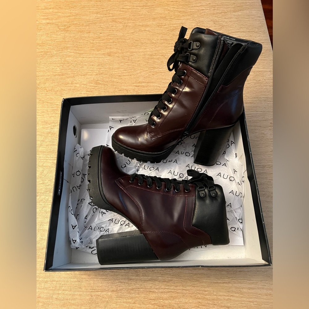 Tie up burgundy and black heel booties.